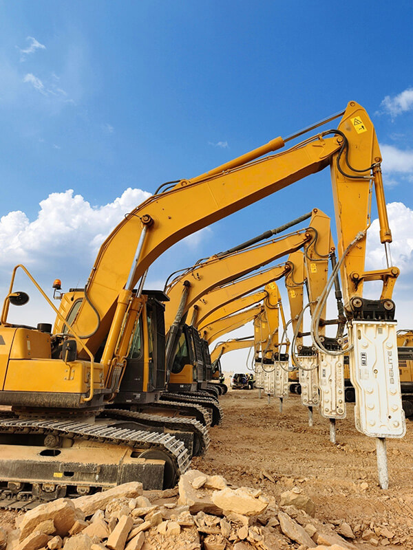 a-line-of-excavators-equipped-with-white-tower-style-hydraulic-breakers