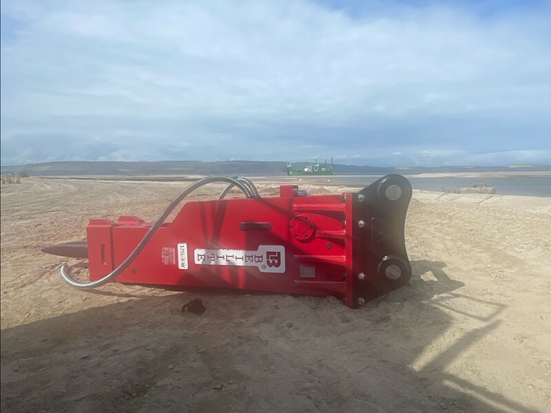 a-red-silent-breaker-lying-flat-on-the-beach