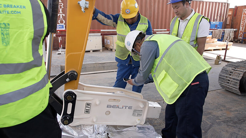service-personnel-are-inspecting-the-hydraulic-breaker-on-site