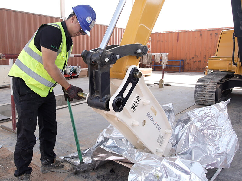 worker-installing-beilite-hydraulic-breaker-construction-machinery