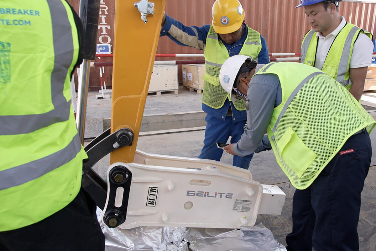 worker-is-inspecting-a-hydraulic-breaker